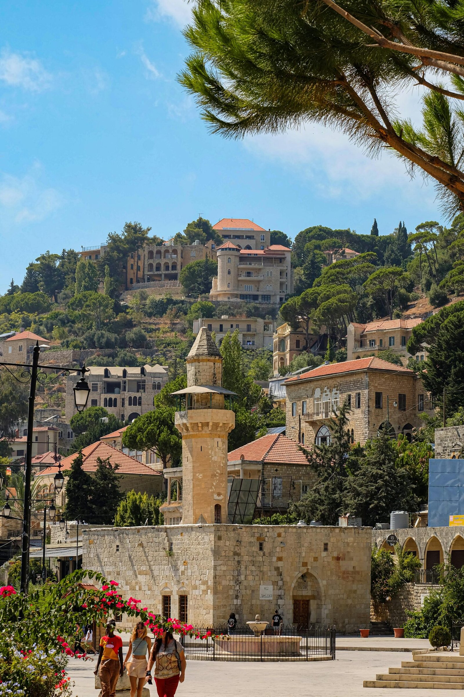 Charming stone village with historic architecture under clear skies.